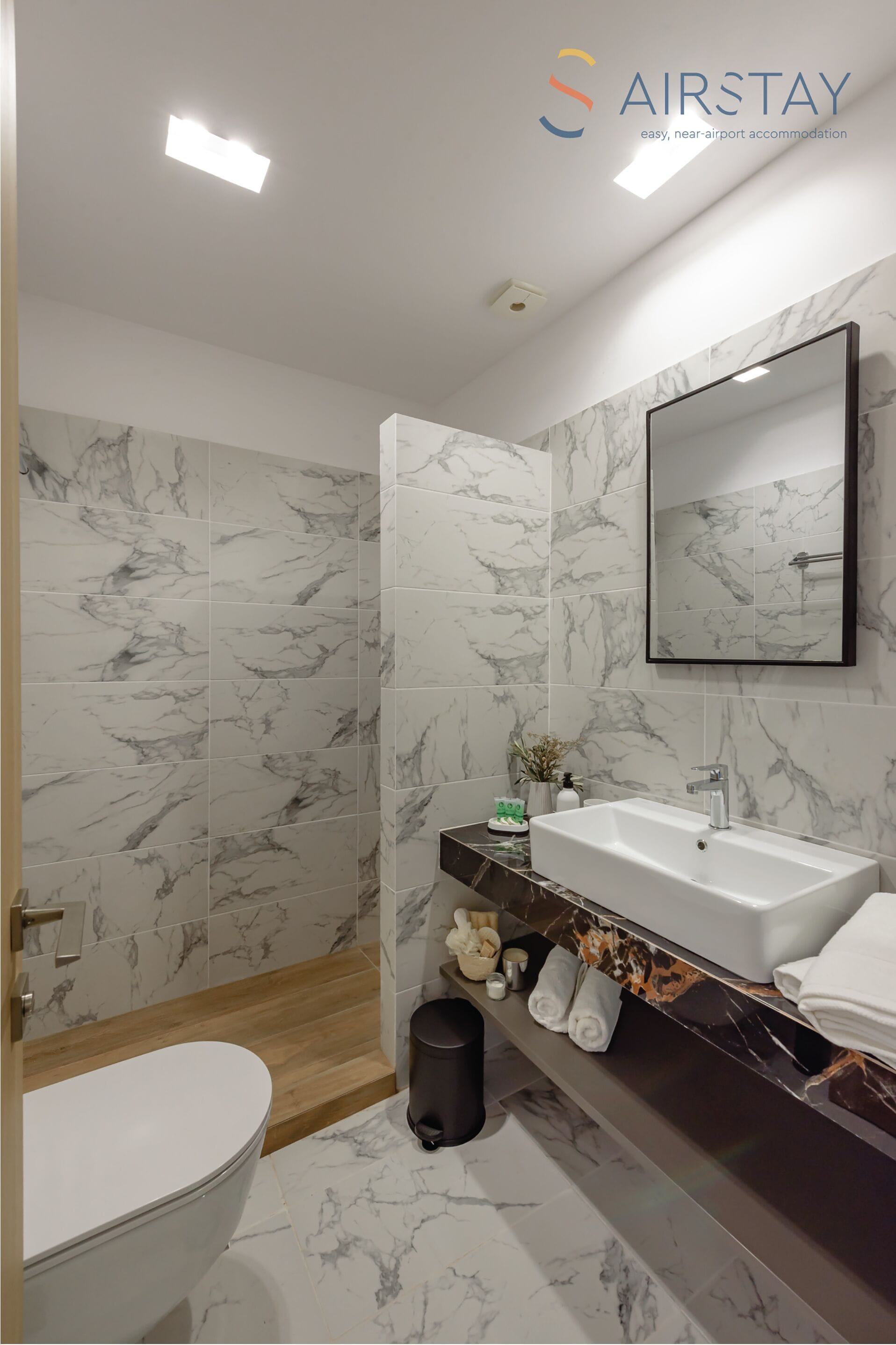 shower, rainfall showerhead, hair dryer, towels