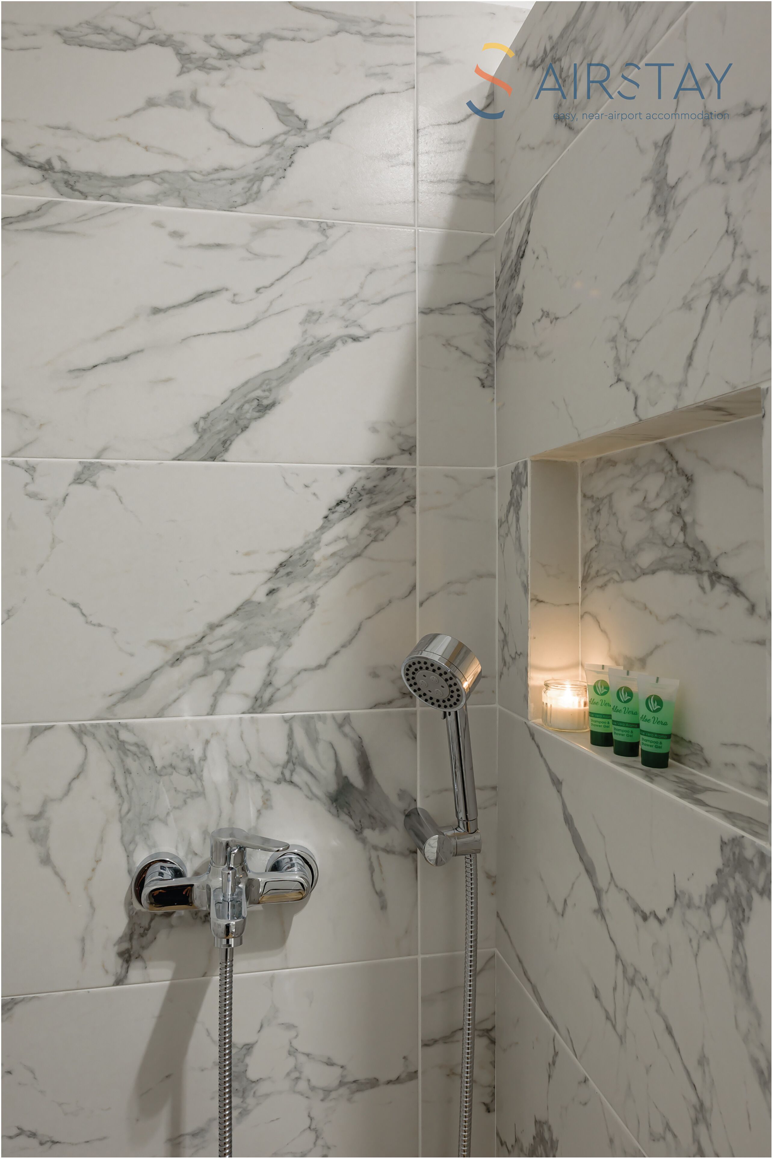 shower, rainfall showerhead, hair dryer, towels