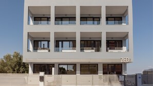 A modern multi-story hotel with a clean, white facade and balconies. - Zed Smart Property by Airstay (Spata-Artemida)