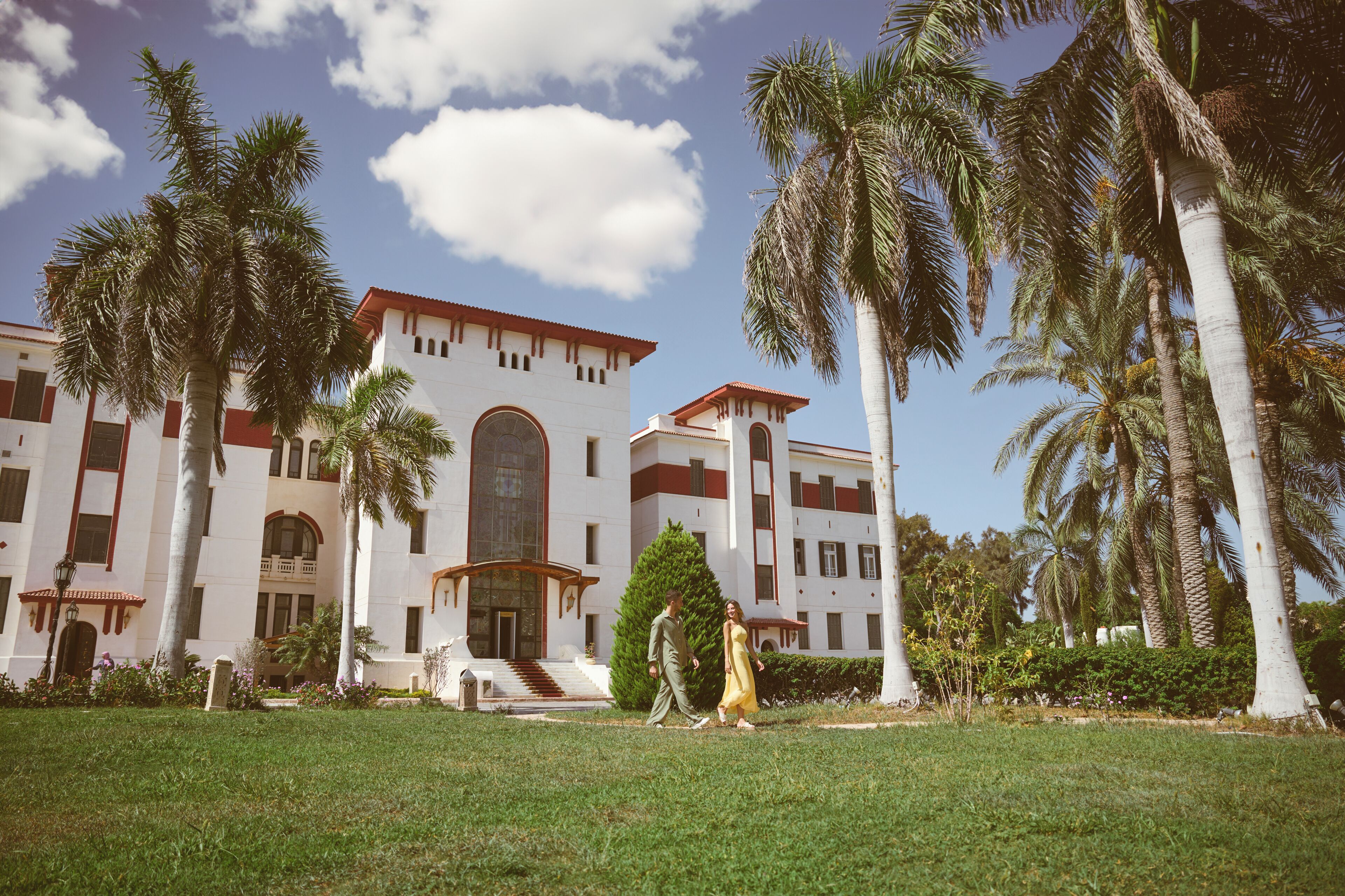 A large building with a symmetrical facade, multiple windows, and a central entrance.