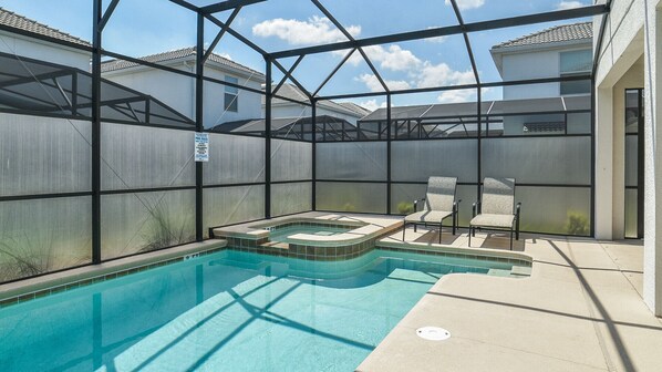 Relax by the pool surrounded by a clear view of the neighborhood.