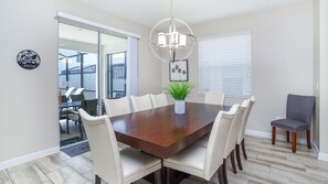 Enjoy meals in this dining area with a large table and six comfortable chairs.