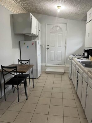 Comfort Apartment | Private kitchen | Full-size fridge, oven, stovetop, coffee/tea maker