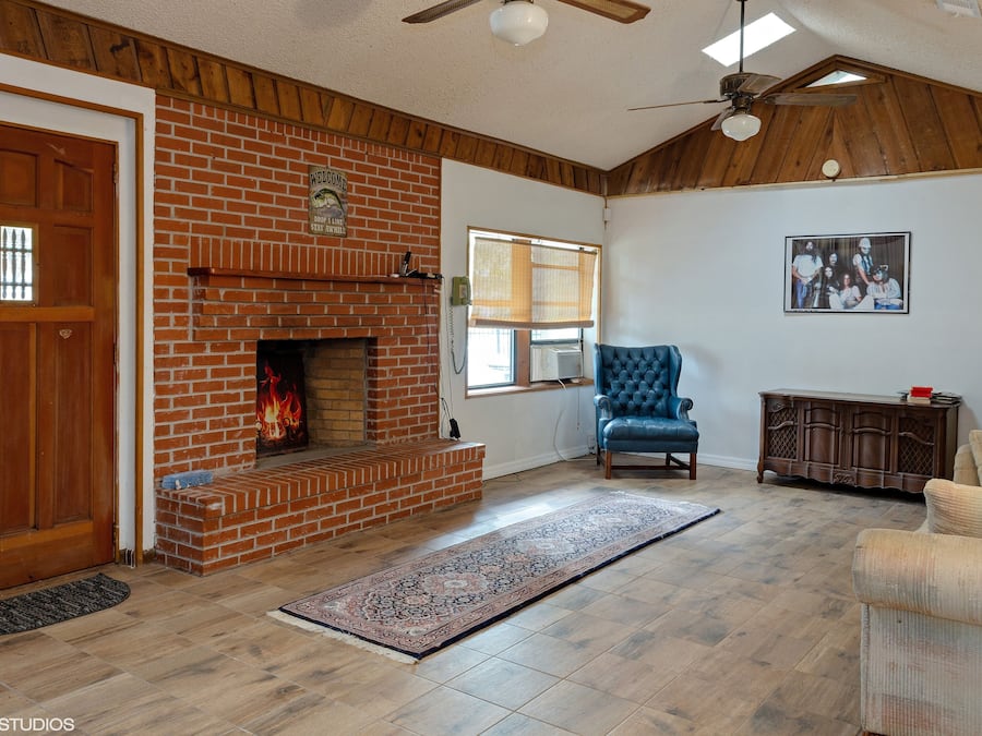 Signature Apartment | Living area | 32-inch Smart TV with satellite channels, DVD player, streaming services