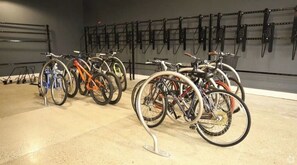 Bicycles are neatly stored on a rack system for easy access.