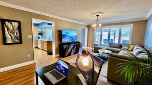 Smart TV, fireplace, books, computer monitors