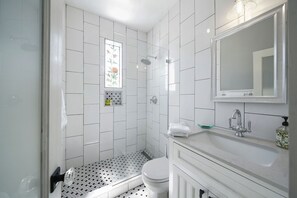Shower, hair dryer, towels, soap