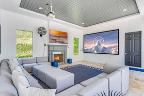 TV, fireplace, video games, table football - The One at Reunion, Arcades, 200″ Theater, Gym & Sunny South-Facing Private Pool (Kissimmee)