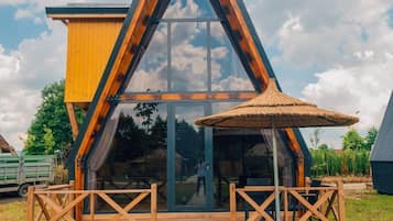 Maison Exécutive, plusieurs lits, bain à remous, vue lac | Coin séjour | Télévision LCD, espaces bureaux