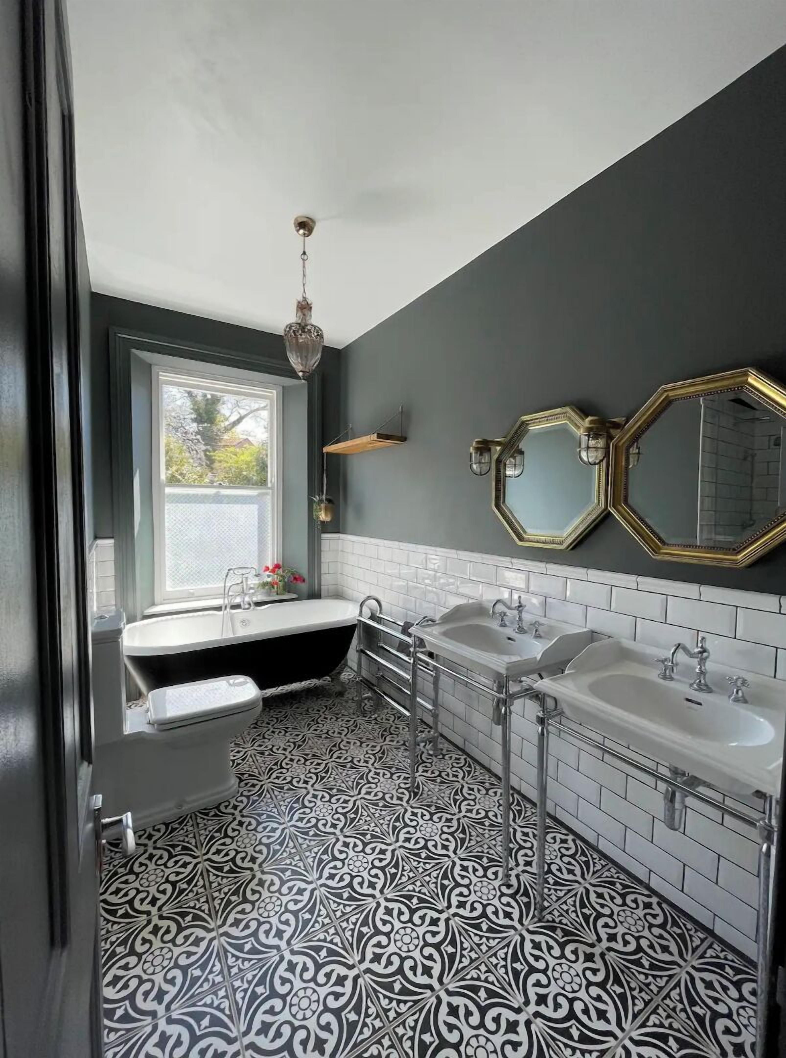 Bathtub, hair dryer, towels, toilet paper