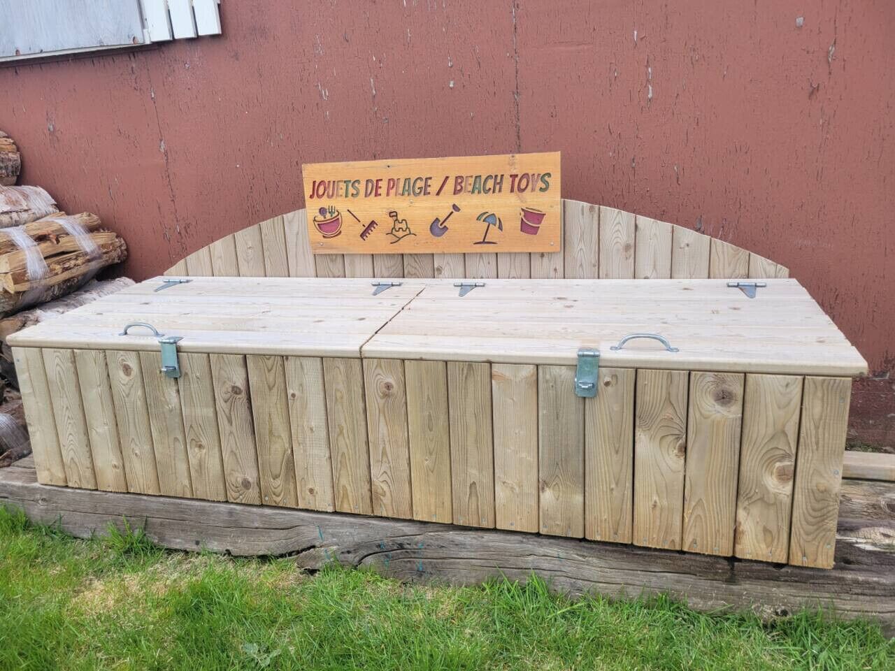 A wooden storage box with a sign above it.