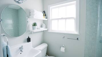 Shower, hair dryer, towels, soap