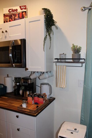 Fridge, coffee/tea maker, cookware/dishes/utensils