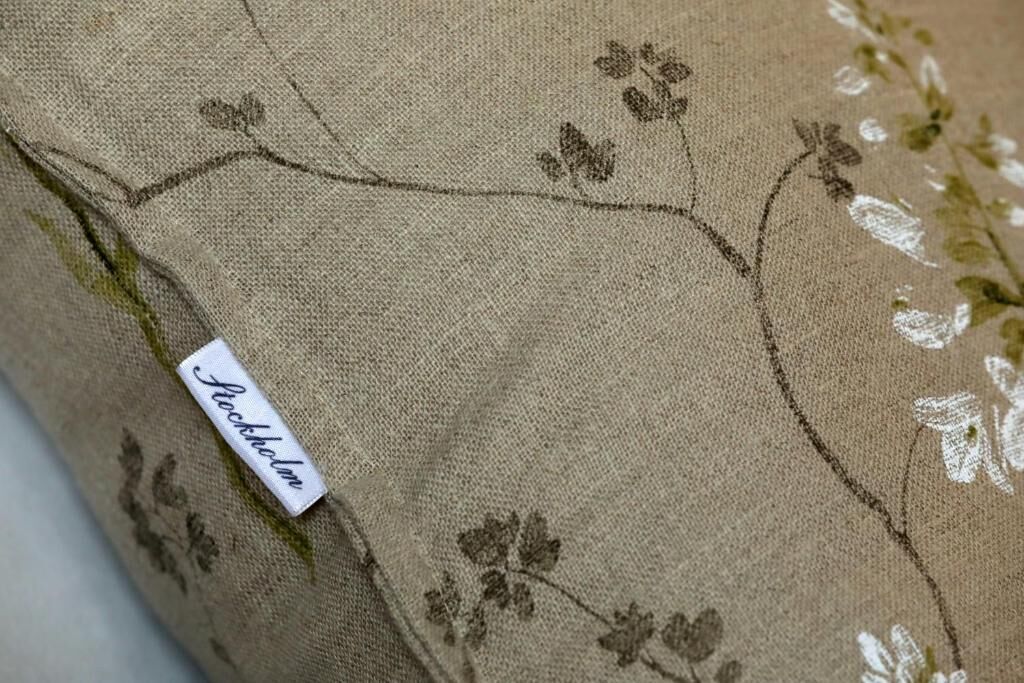 A fabric with a floral pattern and a label reading "Stockholm".