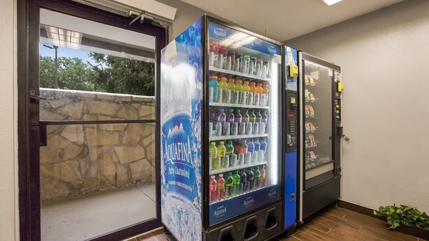 A vending machine with a variety of beverages and a water dispenser. - HomeTowne Studios By Red Roof Princeton – Ewing/ Lawrenceville (Lawrenceville)
