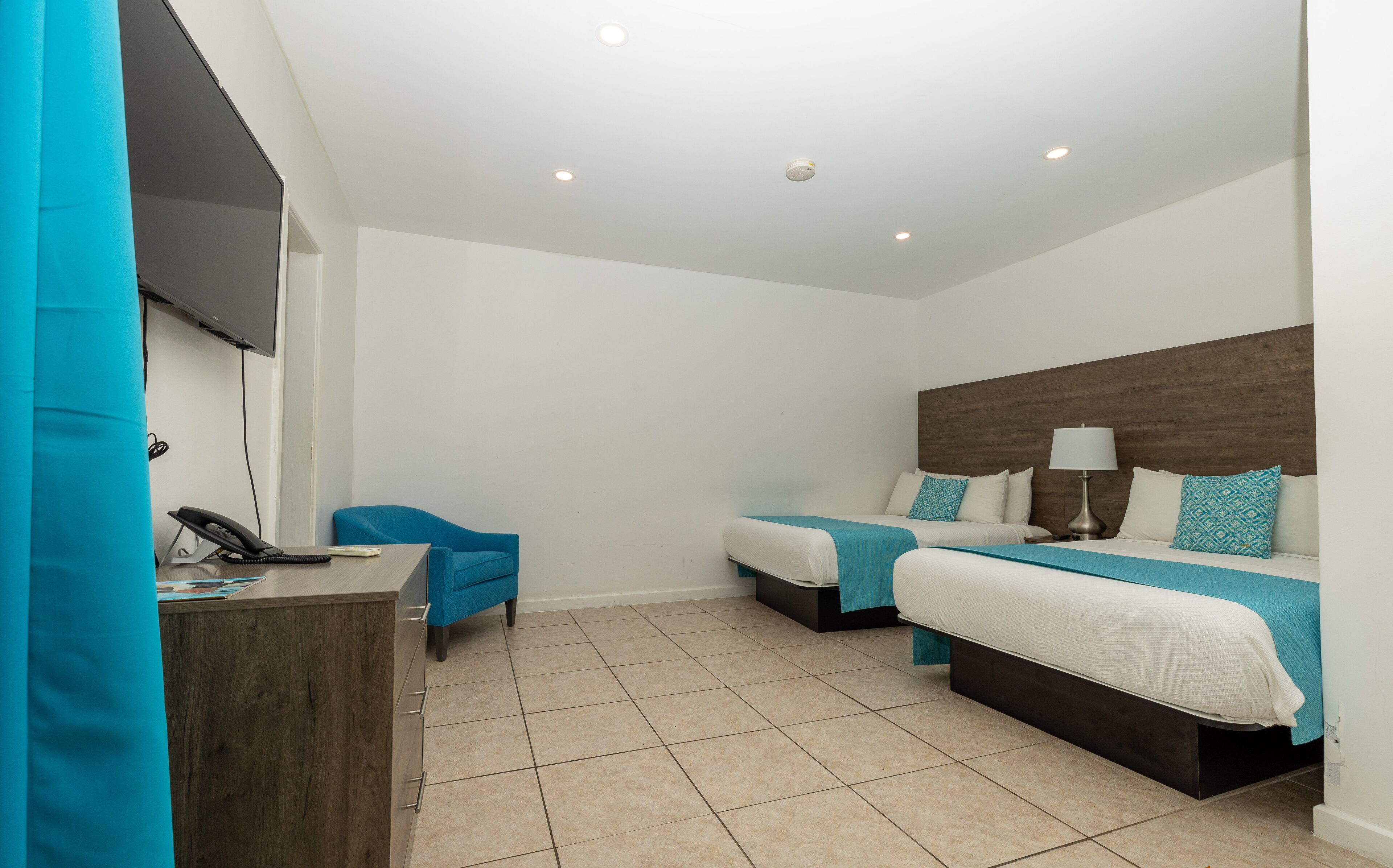 Standard Room, 2 Double Beds | Iron/ironing board, free cribs/infant beds, rollaway beds, free WiFi