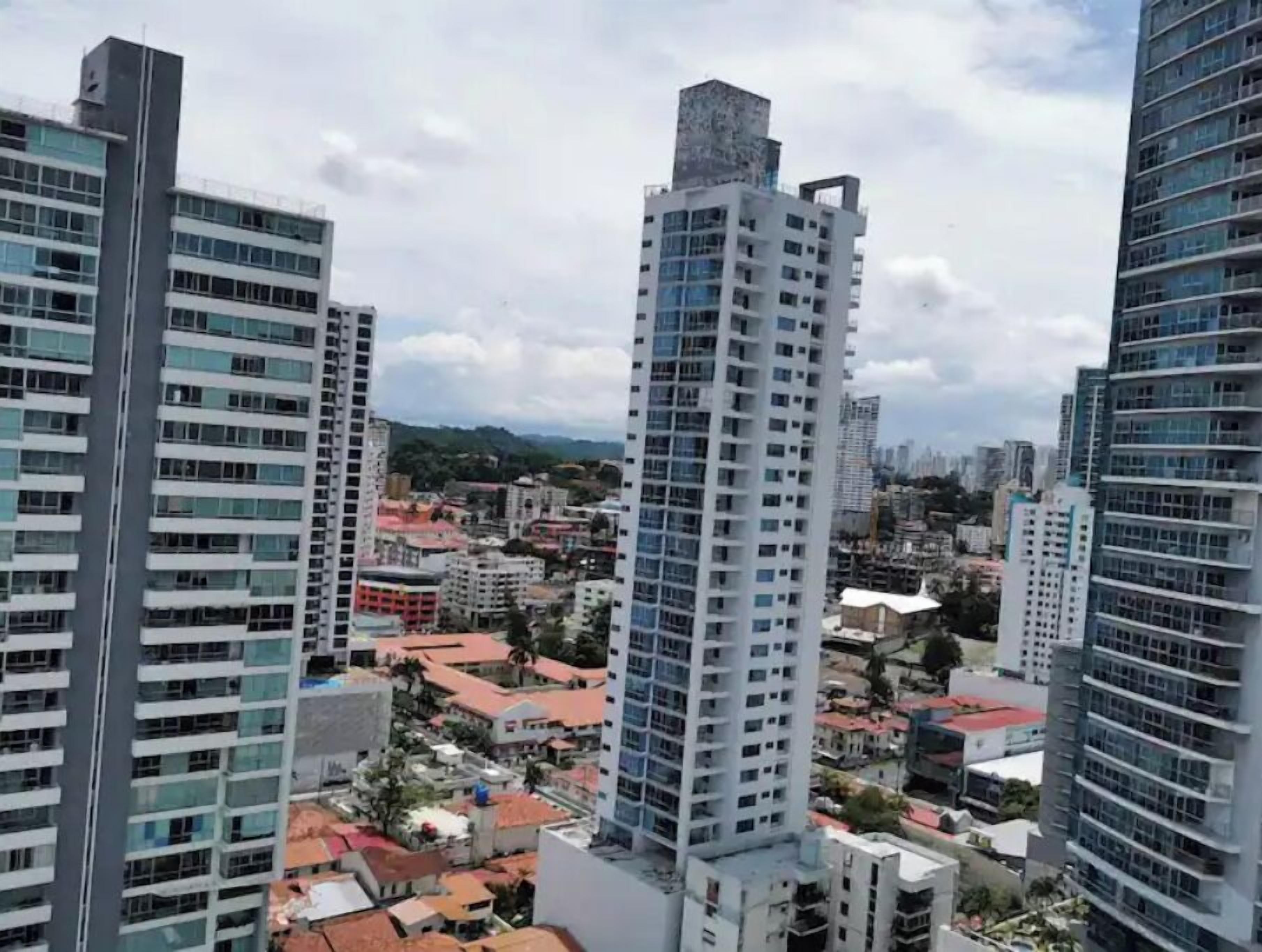 A high-rise building with multiple floors and a modern architectural design.