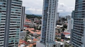 A high-rise building with multiple floors and a modern architectural design. - SPECTACULAR SEA VIEW WITH TERRACE ON BALBOA AV (Panama City)