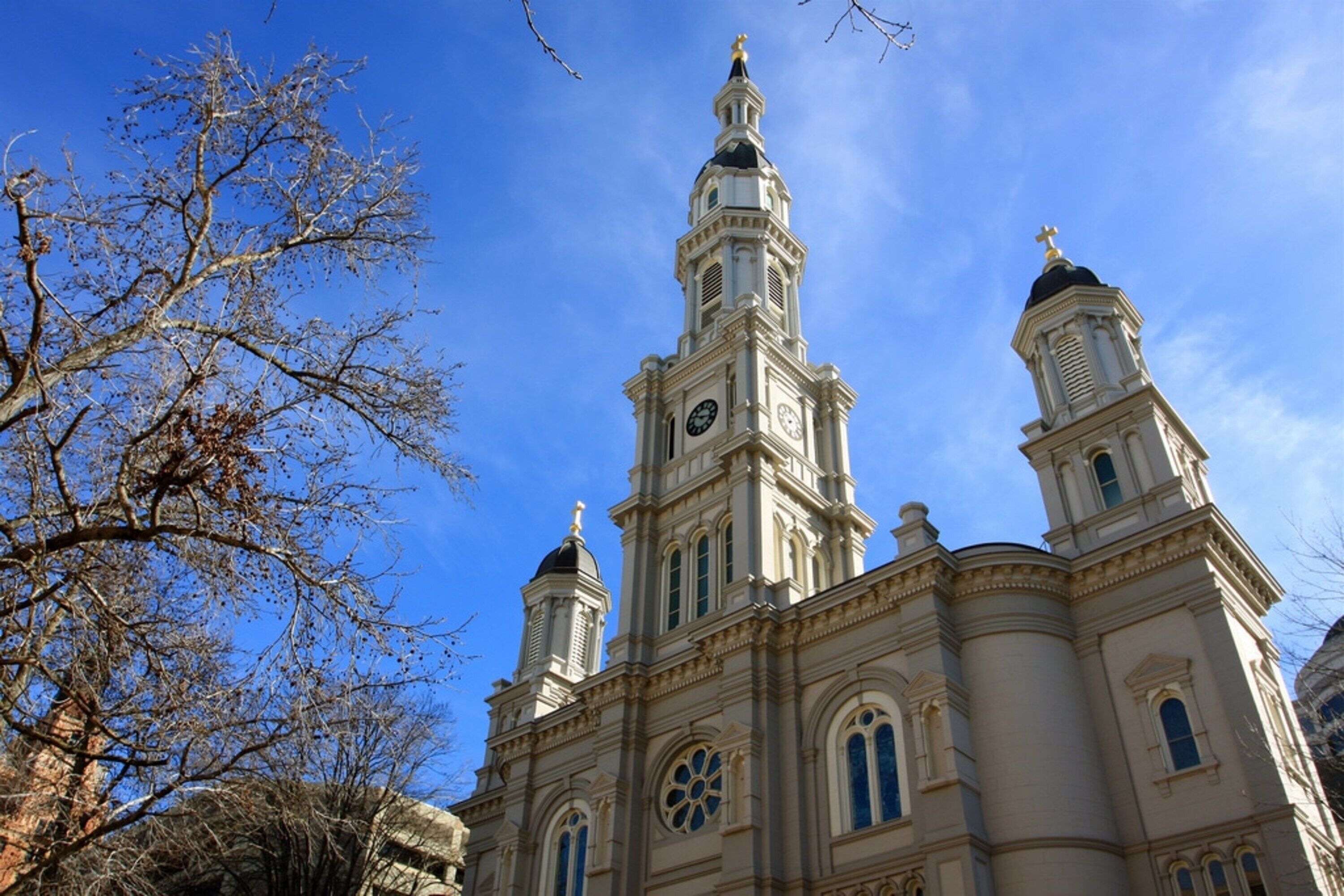 A historic building with a prominent clock tower and arched windows.