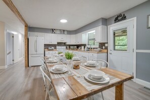 Enjoy meals in this well-equipped kitchen with an oven, microwave, and refrigerator.