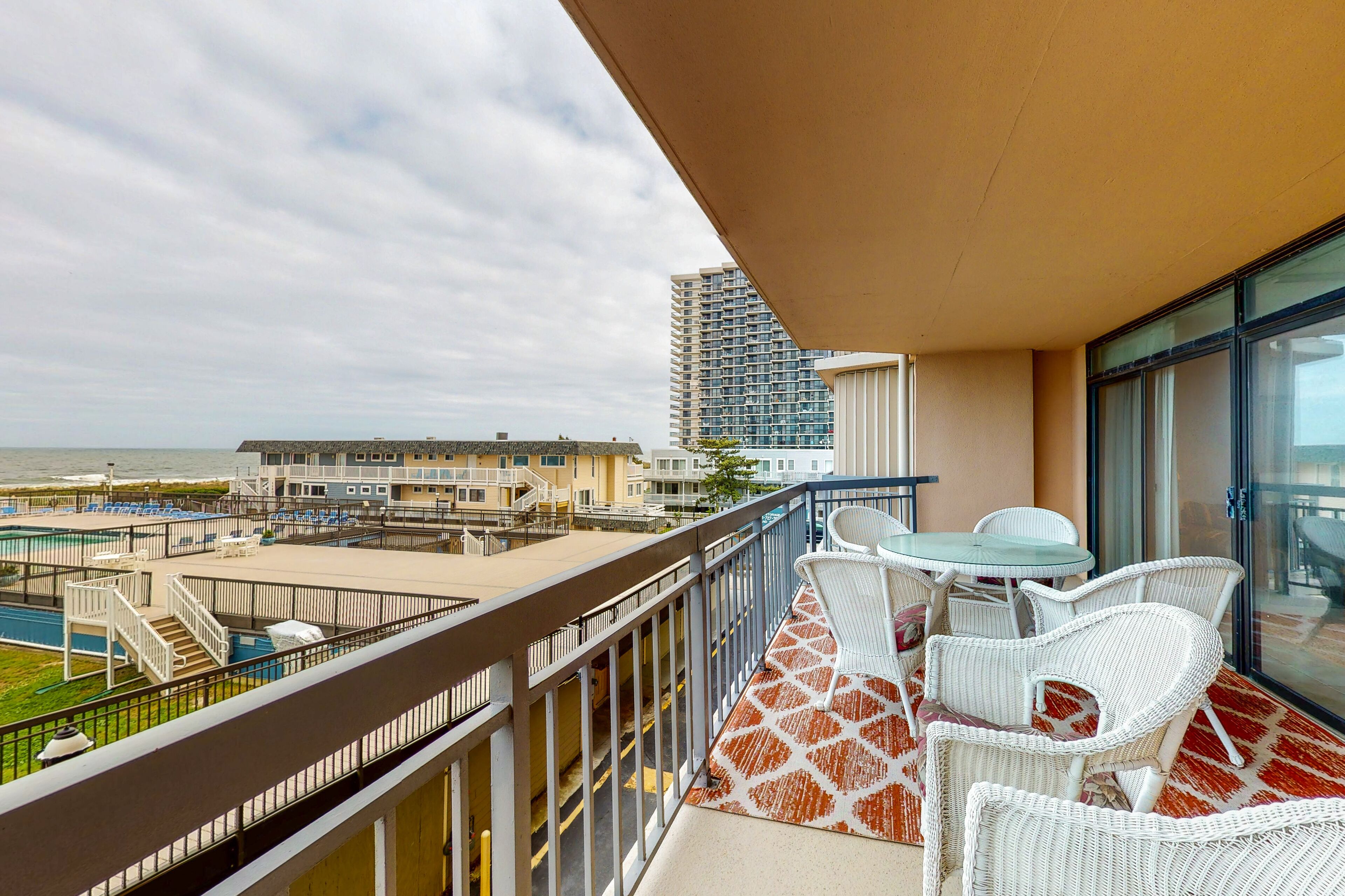 Ocean-view condo with private balcony, central AC, & shared pool/tennis court