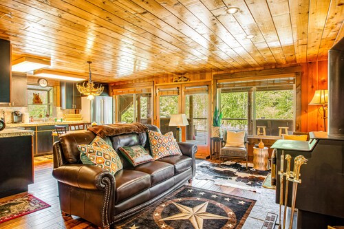 Riverfront cabin & apartment with deck, woodstove, fireplaces, & quiet location