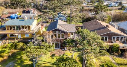 Beachfront home with private beach access, fireplace, washer/dryer, yard, deck
