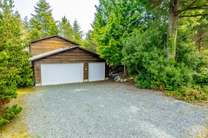 Surrounded by lush greenery, this cabin offers a secluded retreat.