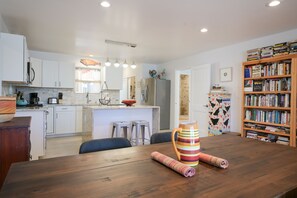 Enjoy cooking in this well-equipped kitchen with a central island and dining area.