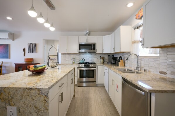 Enjoy cooking in this well-equipped kitchen with an oven, microwave, and dishwasher, plus a large island with seating.