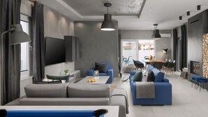 A modern living room with a pool table, sofas, and a dining area. - Villa Ovis in Peresiji (Svetvincenat)