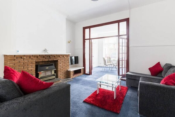 Smart TV, fireplace, books