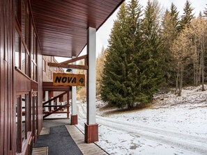 NOVA 4 offers a charming entrance with a covered porch and metal grate.