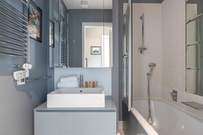 Bathtub, hair dryer, towels