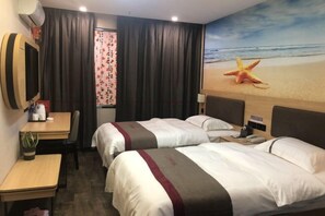 A hotel room with two beds, a desk, a chair, a TV, and a beach-themed wall mural. - Shangkeyou Chain Hotel (Xinxing Shidai Plaza) (Xinxing)