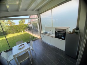 Fridge, microwave, stovetop, coffee/tea maker