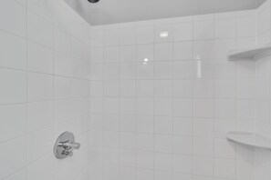 Bathtub, hair dryer, towels, soap