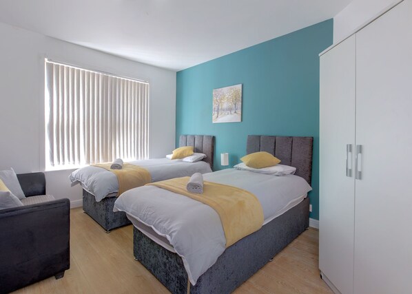 4 bedrooms, desk, iron/ironing board, travel crib