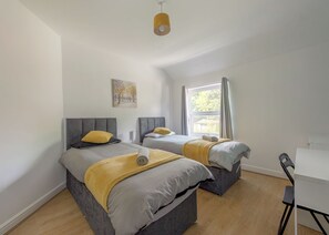 4 bedrooms, desk, iron/ironing board, travel cot