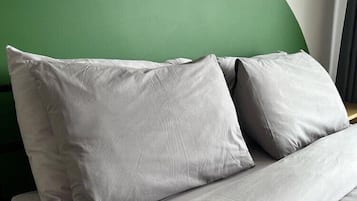 Individually decorated, desk, laptop workspace, bed sheets