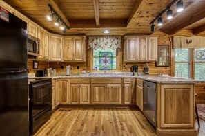 Microwave, dishwasher, coffee/tea maker, cookware/dishes/utensils