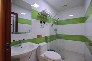 A bathroom with a sink, toilet, and shower. - the 80youth Chain Hotel from Dongguan (Dongguan)