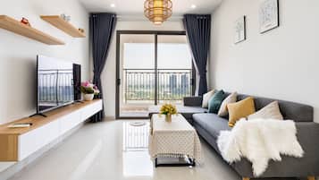 Luxury Apartment, 2 Bedrooms, River View | Living room | 55-inch Smart TV with cable channels, TV