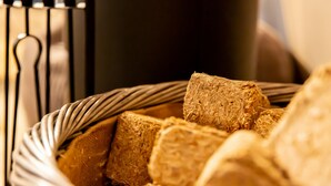 A basket filled with whole grain bread. - Knole Luxury Dome (Hoath)