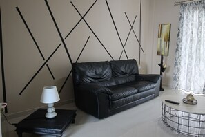 Apartamento luxo | Área de estar | TV de tela plana