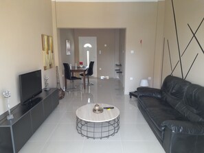 Deluxe Apartment | Living area | Flat-screen TV - Christa's Home near ATH Airport (Markopoulo Mesogaias)