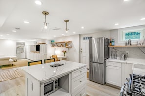 Enjoy cooking in this well-equipped kitchen with an oven, microwave, and gas stove.