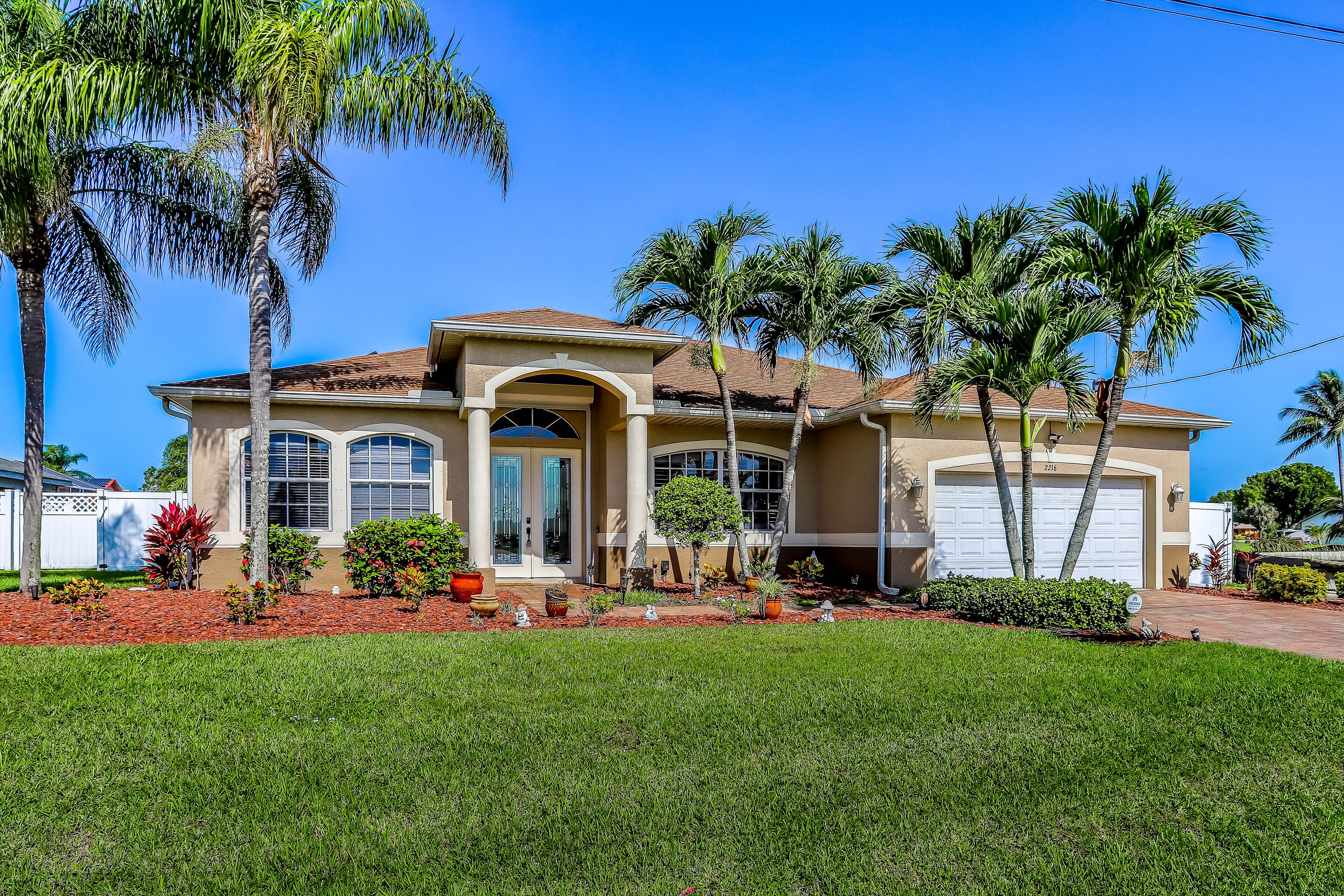Dog-friendly home on canal with heated pool, hot tub, central AC, & washer/dryer