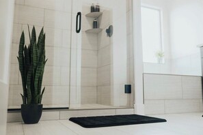 Bathtub, hair dryer, towels, soap