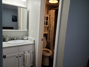 Bathtub, towels, soap, toilet paper